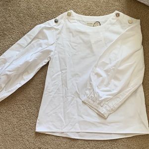 Zara girls. White blouse with buttons on the shoulder.